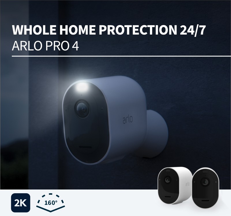 A night-time view of an arlo Pro 4 camera attached to a door outside with the spotlight shining. Whole Home protection. 2K and 160 degree angle images are displayed.