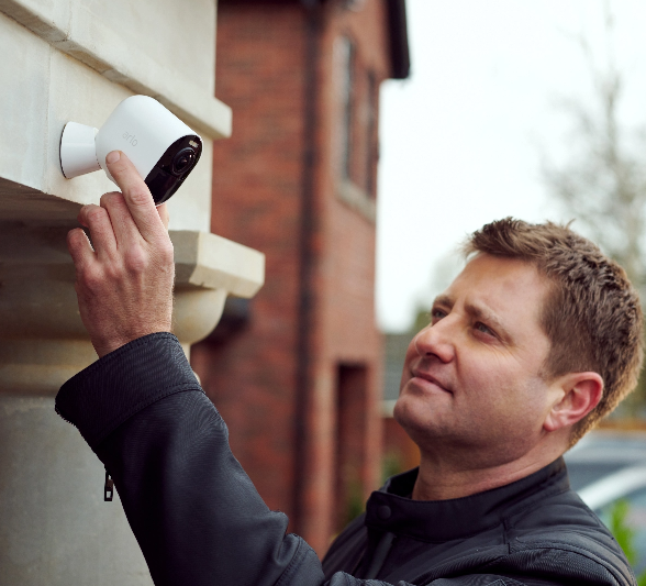 George Clarke, Influential architect on TV, adjusts the Arlo security camera mounted at the front of the house