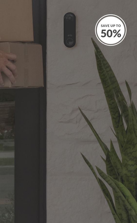 Delivery man dropping off package with Arlo Video Doorbell on door