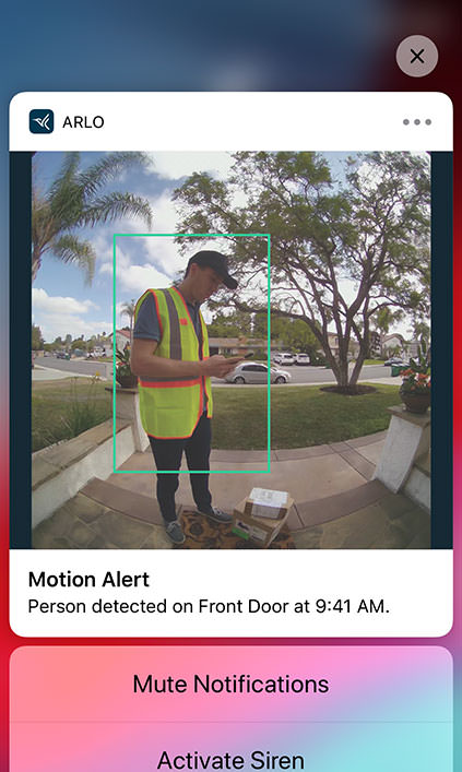 Smart phone displaying Arlo Secure App motion alert detecting person delivering package