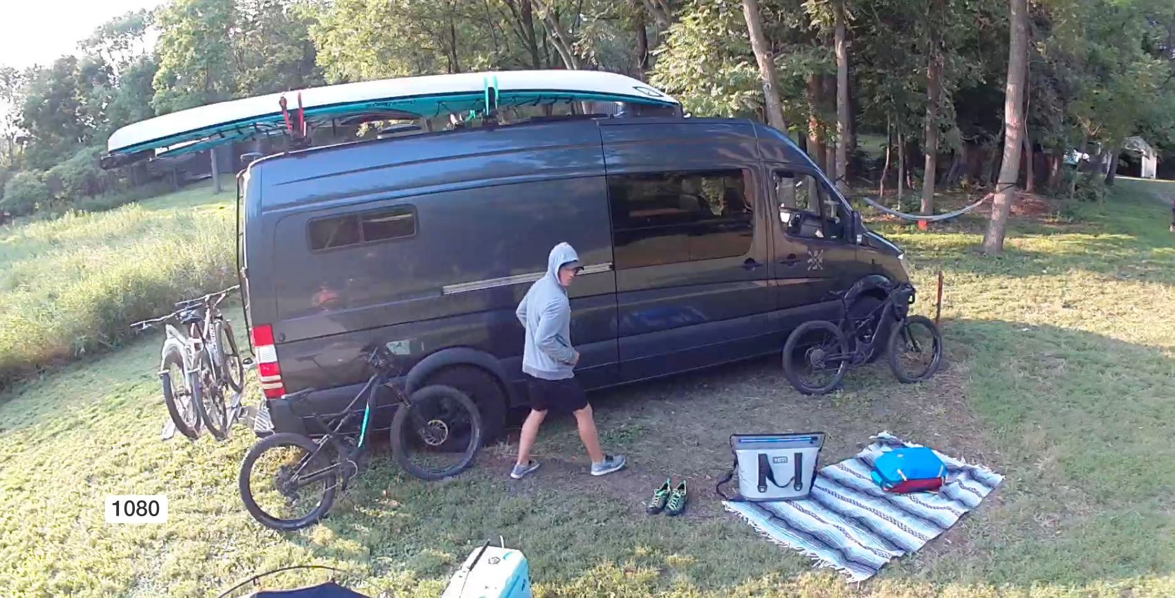Smart phone displaying crisp 1080p video recording of person creeping outside a camper van